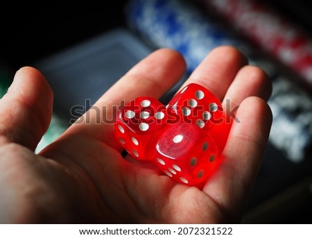 red playing dice, poker plastic chips, close-up, macrophotography, selective focus, blurry background, risk concept, stock exchange game, casino, gambling, gambling, excitement