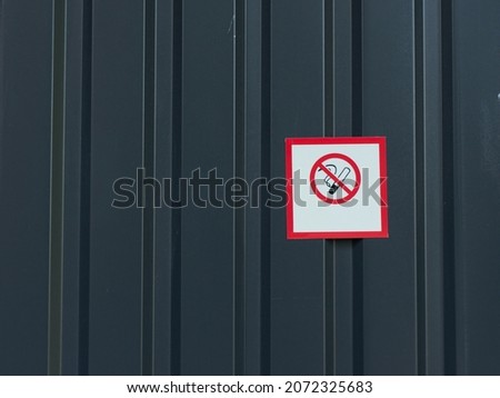 No smoking sign on dark gray wall