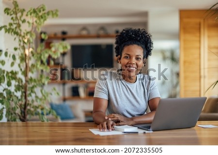 Portrait of confident adult woman, applying for an online class Royalty-Free Stock Photo #2072335505