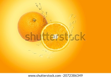 Water drops fresh Orange fruits isolated on Orange background.