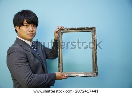 Business man male with picture frame