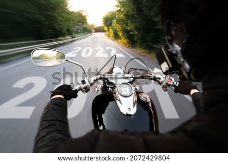 Motorcyclist riding into the 2022 year