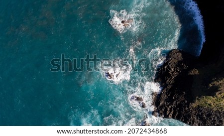 The sea crashing against the rocks Tenerife's north coast topdown view