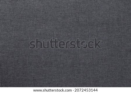 Dark grey fabric cloth texture for background, seamless pattern of natural textile.
