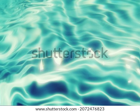 Blur​ abstract​ of​ surface​ blue​ water. Abstract​ of​ surface​ blue​ water​ reflected​ with​ sunlight​ for​ background. Blue​ sea. Blue​ water​ splashed​ use​ for​ graphic​ design.