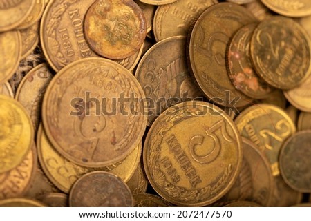 Old coins out of circulation in bulk, background image, close-up, selective focus Royalty-Free Stock Photo #2072477570