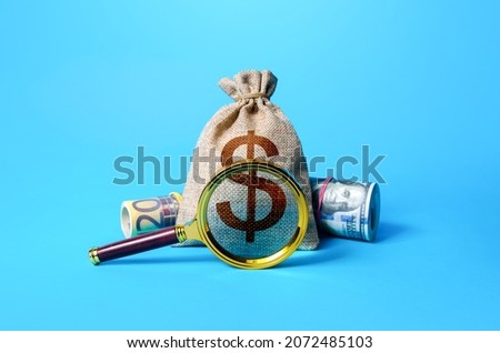 Dollar money bag and magnifying glass. Investigating capital origins. Anti money laundering and tax evasion. Find investment funds for business project. Profitable deposit or loan terms and conditions Royalty-Free Stock Photo #2072485103