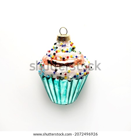 Christmas tree toys cupcake isolated on white background, square image, top view