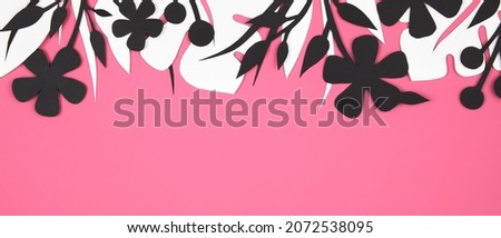 Bright pink banner with beautiful floral black and white paper cut art. Leaves and flowers corner frame. Top view, Flat lay, copy space