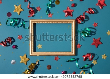 Shiny festive christmas, new year background with golden frame, stars, streamers, sparkles with copy space
