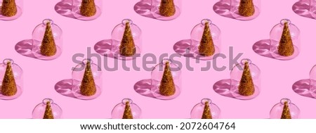 Christmas tree under glass on a pink background. Christmas concepts with copy space. New year and christmas concept in quarantine. Quarantine sample. Banner