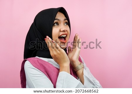 Close-up of beautiful young Muslim woman surprised, wow expression, isolated
