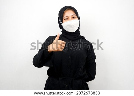 Muslim women wearing white masks, anti corona virus movement, anti covid-19 movement, health movement using masks, with hands showing ok sign, good work, success, victory, isolated on white background