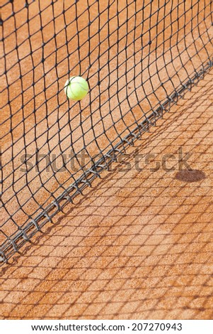tennis ball in net