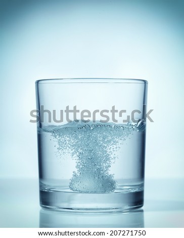 effervescent dissolving fizzy tablet in water glass