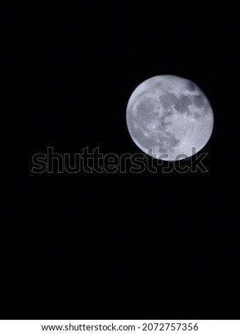 The full moon in the clear sky