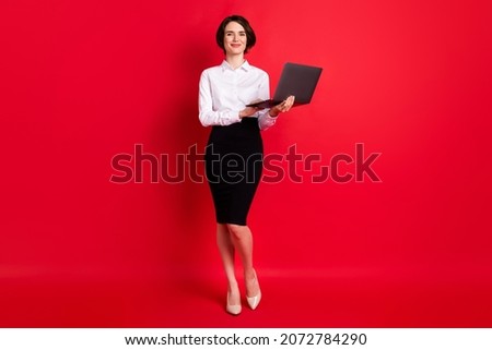 Full length body profile photo business woman keeping laptop smiling isolated vivid red color background