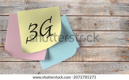 Sticky note with the inscription 3G on a wooden wall Royalty-Free Stock Photo #2072785271