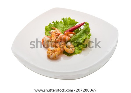 Unshelled king prawn heap with salad leaves