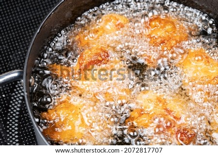 Frying Chicken Nuggets in Vegetable Oil, Food or Cooking Background, Nobody Royalty-Free Stock Photo #2072817707