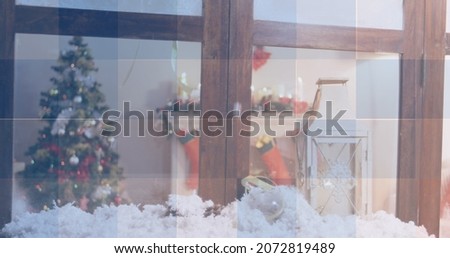 Image of squares in red, white and blue of flag of america, over christmas tree and decorations. patriotism, tradition, christmas and celebration concept digitally generated image.