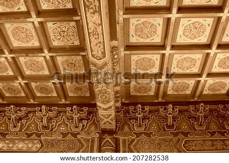 Chinese traditional style ceiling in a temple, closeup of photo