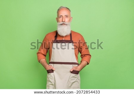 Photo of aged business man confident hands in pocket shop owner service isolated over green color background