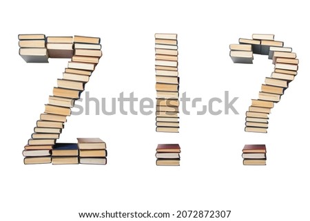 Question, exclamation mark, Z from books. Alphabet isolated on white background. Font composed of spines of books.