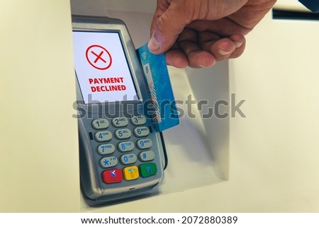 Credit card swiping failed. The payment was rejected. Payment by card at the terminal. I ran out of money on my credit card. The debit card bank account is blocked. Concept. Royalty-Free Stock Photo #2072880389