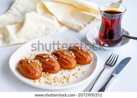 Delicious turkish sweet sekerpare on served. Traditional Turkish dessert sekerpare on a white background
