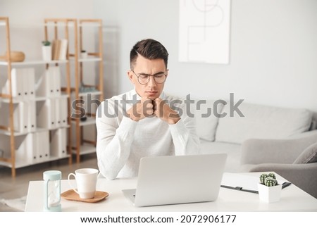 Psychologist working with patient online in office