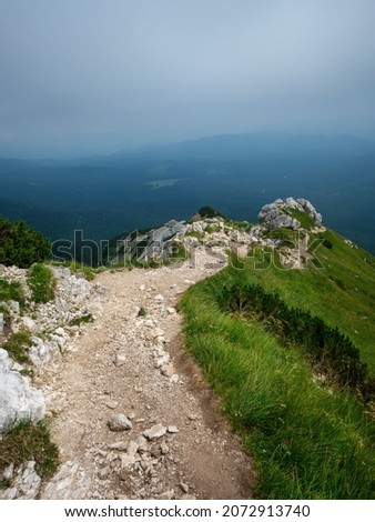 gravel hiking trails in Tatra mountains in Slovakia. green summer hills with mist and great scenery
