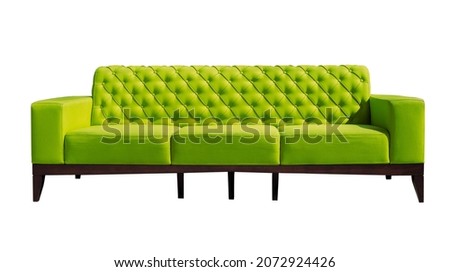 Big lime green sofa with black wooden legs isolated. Upholstered furniture for the living room. Bright green couch isolated Royalty-Free Stock Photo #2072924426