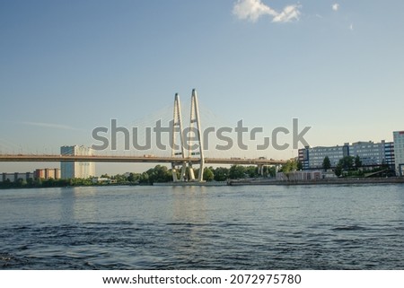 Modern road Vantovyi bridge across river. Summer travel concept