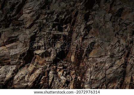 Mystic grim mountain rock prison. Fogy spooky fortress in dark alley. Old cragged creepy mythical cliff. Vintage fearful crannied horrible stone. Damaged terrible karst cavern for crime mystery drama Royalty-Free Stock Photo #2072976314
