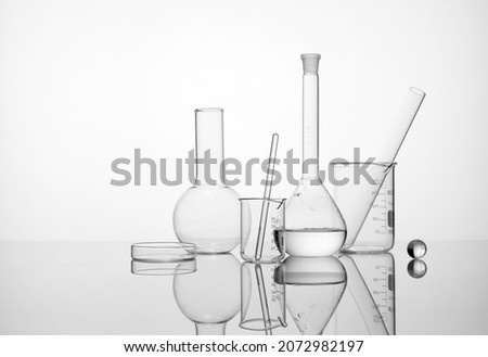 Laboratory equipment beakers and flask with backlight in different group Royalty-Free Stock Photo #2072982197