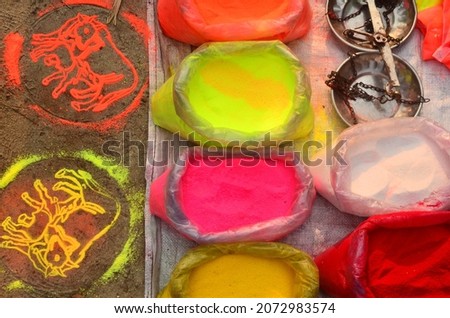 Loose colors on sale street side. Stencils make patters for decoration as on left hand side with same colors.