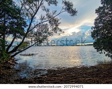 sunset on the lake sky and clouds, beautiful photo digital picture , picture taken in Sweden, Europe , Digital created image Picture