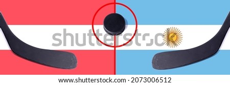 Top view hockey puck with Austria vs. Argentina command with the sticks on the flag. Concept hockey competitions