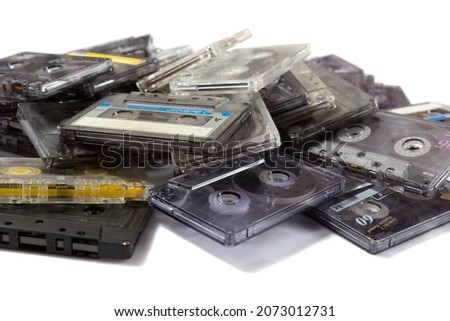 pile of audio compact cassettes on a white background