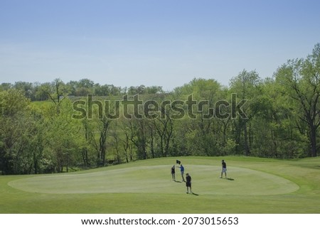 Picture of golfers on the green