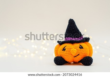 Cute pumpkin in witch hat with copy space