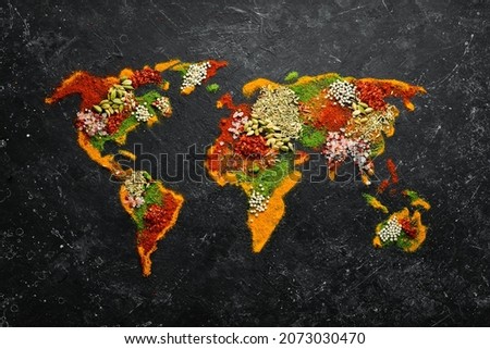 World map - Set of spices and condiments on a black background. Top view.