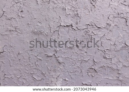 Gray painted wall that cracked