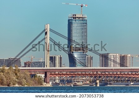 View of modern skyscraper building on a waterfront, Belgrade, Serbia. Royalty-Free Stock Photo #2073053738