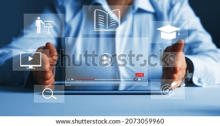 Education internet Technology. E-learning education, internet lessons and online webinar. Person who attends online lessons on a digital screen. Royalty-Free Stock Photo #2073059960
