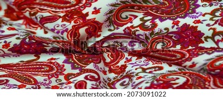 Paisley red pattern on a white background. The pattern is sometimes referred to as "Persian pickles" by American traditionalists, especially patchwork craftsmen, or "Welsh pears" in Wales
