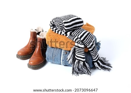 Concept of winter clothes isolated on white background.