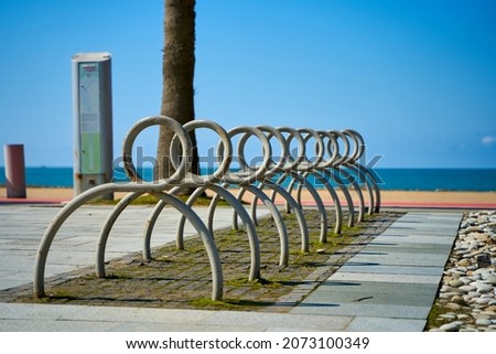 Bicycle parking on the waterfront near the city beach.