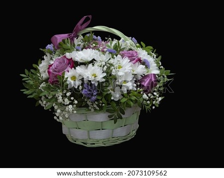 Bouquet of flowers in a basket isolated